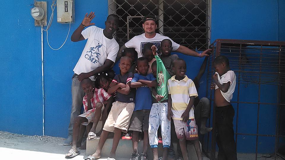 Cars4Haiti.org volunteers with children